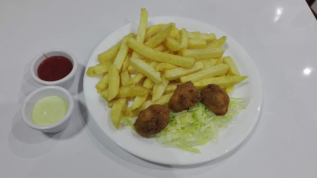 Rolli's Restaurante-Pollos y Carnes